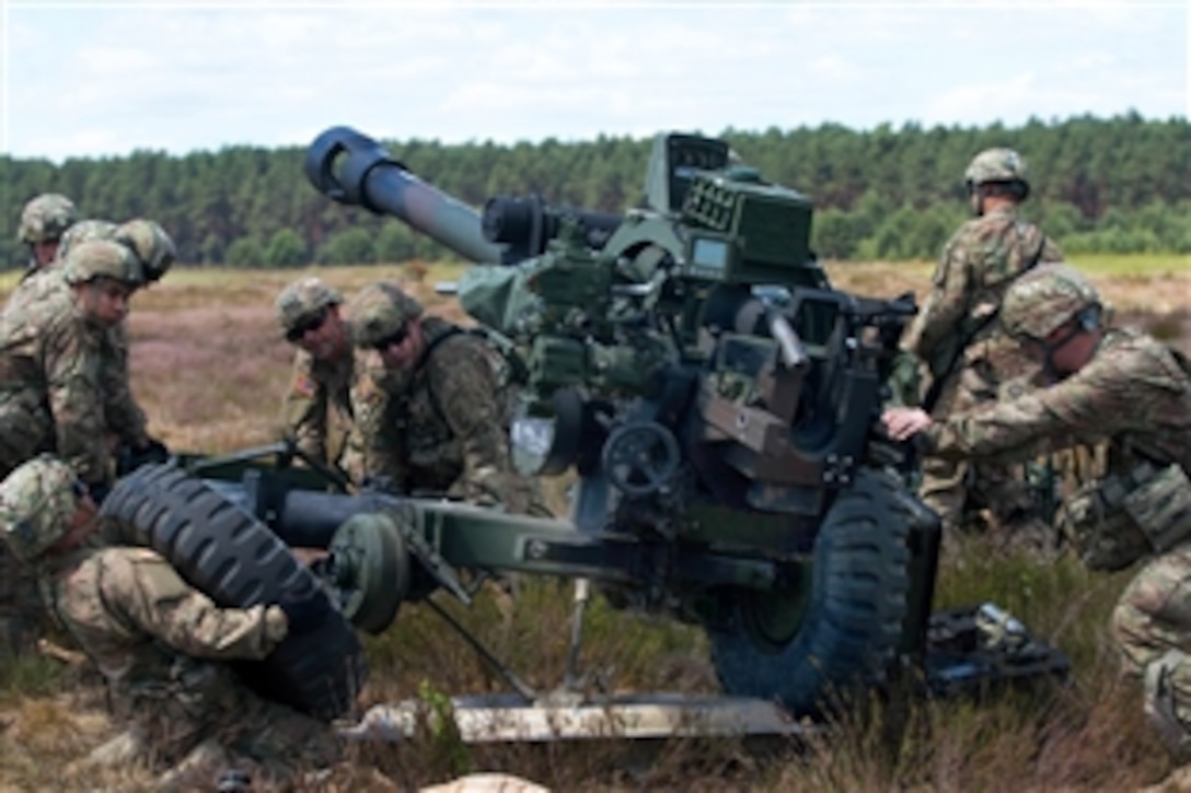 U.S. soldiers assemble a M119 105mm towed howitzer after jumping from a Boeing C-17 for an airborne operation during Saber Strike 15, a U.S. Army Europe-led training exercise in Drawsko Pomorskie, Poland, June. 15, 2015. This year’s event, which takes place across Estonia, Latvia, Lithuania and Poland, aims to improve joint operational capability in a range of missions.