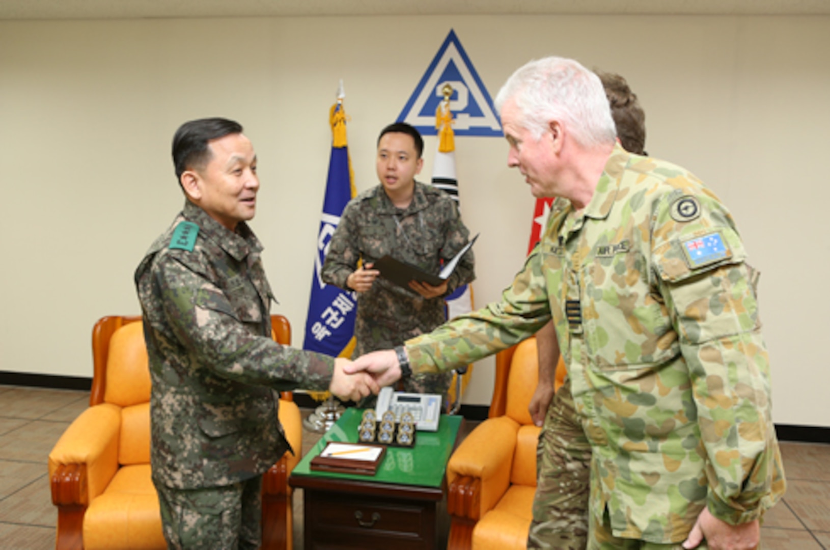 Gen. Soon Jin Lee, commander of Republic of Korea Army 2nd Operational Command, greets Australian Air Force Capt. Ralph Kettle, deputy director of Multi-National Coordination Center, during an office call at the 2OC Headquarters in Daegu, Republic of Korea March 4 as part of the annual Key Resolve Exercise. This exercise includes multi-national forces that contribute to readiness as United Nations Command “Sending States”. The Sending States are comprised of the 16 nations that provided combat, combat support, or combat service support during the Korean War and were present during the signing of the Armistice Agreement. Their contributions are coordinated through the MNCC. 
