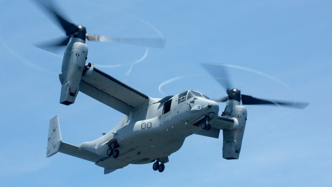 An MV-22 Osprey with Marine Medium Tiltrotor Squadron 261 soars above the Karel Doorman, a Dutch warship, during an interoperability test near Marine Corps Air Station New River, N.C., June 12, 2015. The unit worked jointly with the Royal Netherlands Navy to perform the first MV-22 Osprey carrier landing aboard a Dutch warship and strengthened the existing partnership between the two countries.