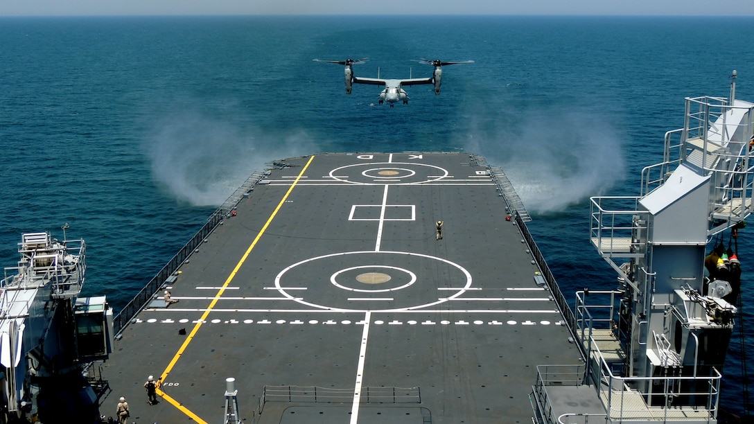 An MV-22 Osprey with Marine Medium Tiltrotor Squadron 261 prepares to land onto the Karel Doorman, a Dutch warship, during an interoperability test near Marine Corps Air Station New River, N.C., June 12, 2015. The unit worked jointly with the Royal Netherlands Navy to perform the first MV-22 Osprey carrier landing aboard a Dutch warship and strengthened the existing partnership between the two countries.