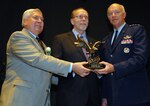Rep. Dave Loebsack, Iowa, is presented an award by Air Force Lt. Gen. Bud
Wyatt, chief of the Air Guard, and retired Chief Master Sgt. Roger Hagan,
president of the Enlisted Association of the National Guard of the United
States, during a ceremony in Washington, D.C., March 7, 2011. The congressman
received the award for his significant contribution to the National Guard
through his legislation of the Post 9/11 GI Bill.