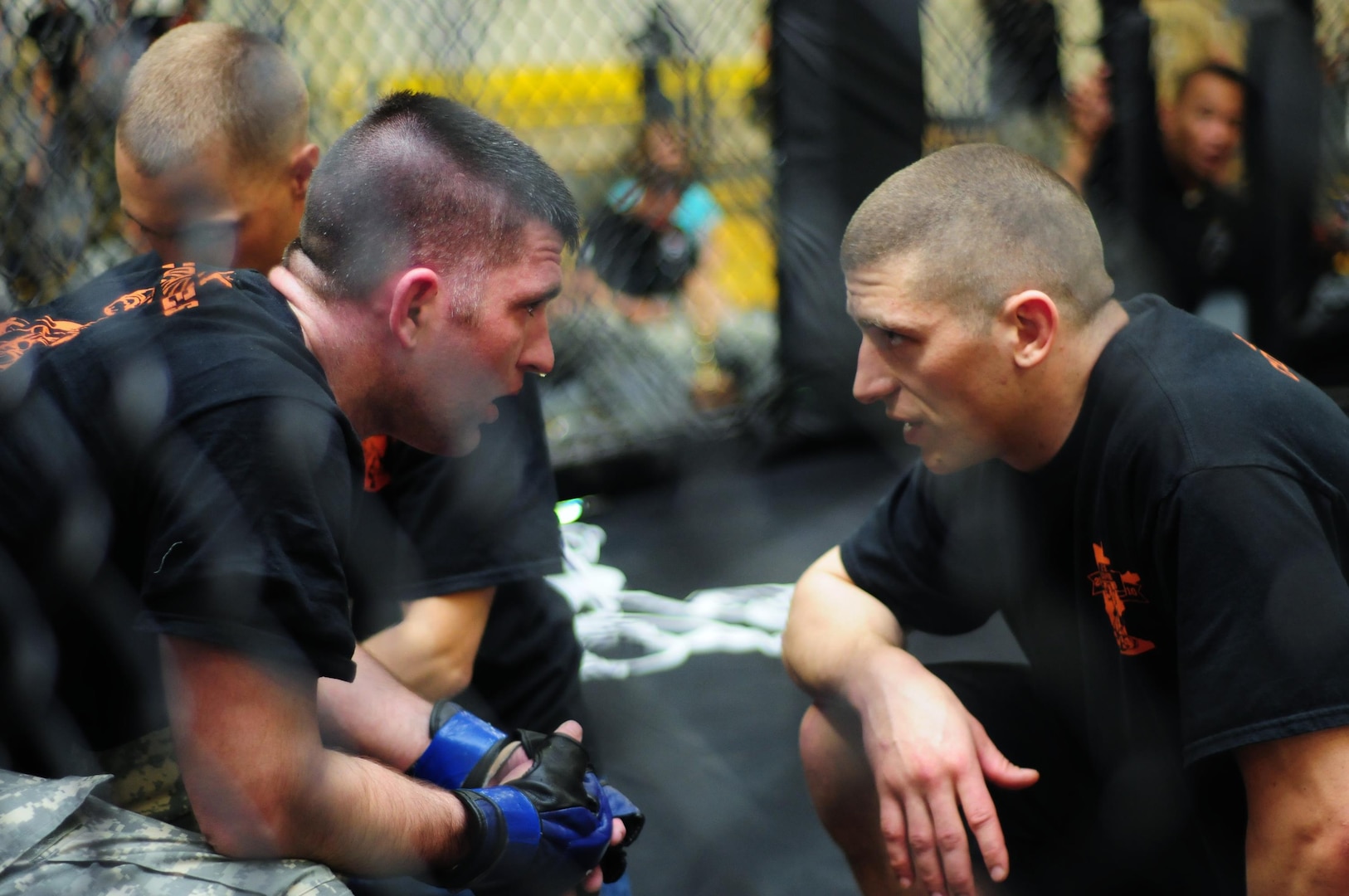 Welterweight Army Capt. Bernard Williamson of Minnesota, left, listens to advice from his coach between rounds March 20, 2011, at the 2011 Army National Guard Combatives Tournament. (Photo by Alexandra Hemmerly-Brown) (Released)