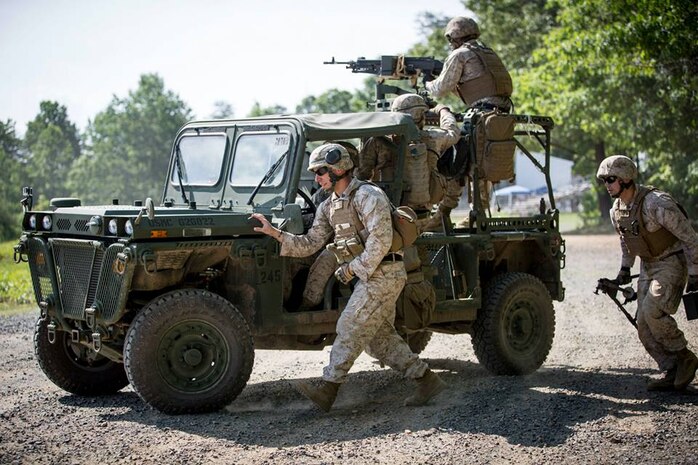 Marines from The Basic School (TBS) participate in determining the effectiveness of unloading and loading munitions from the M1161 Growler Internally Transportable Vehicle (ITV).