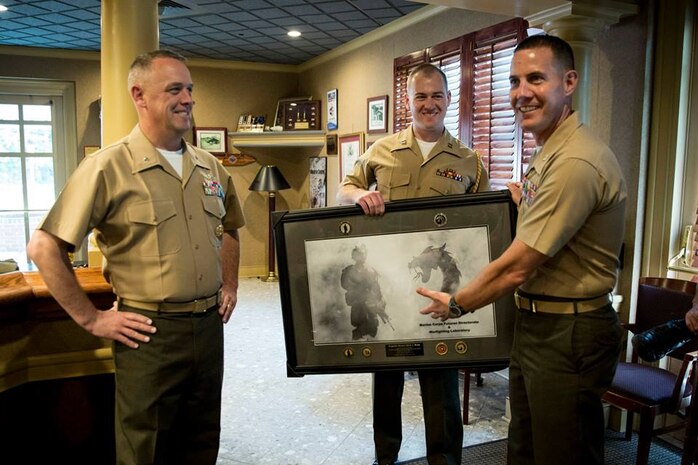 Brigadier General Kevin Killea (left), the Futures Directorate Director and Commanding General of the Warfighting Laboratory is presented with a parting gift from the Futures Directorate by Deputy Director Colonel Jeff Holt (right) and Captain Jerald Feehery (center).

An early summer Hail and Farewell was hosted at the Clubs at Quantico Friday June 12 to formally welcome a few new members of the team and to say farewell and thank you to those moving on to the next phase of their lives and military careers.