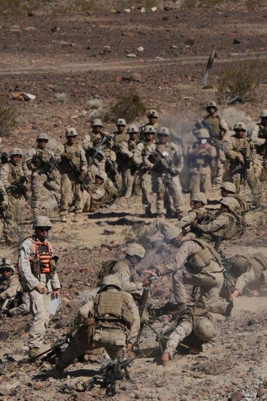 Marines with Bravo Company, 1st Battalion, 23rd Marine Regiment, 4th Marine Division, Marine Forces Reserve, shoot mortars during the live fire company attacks during the 2015 integrated training exercise at Marine Corps Air Ground Combat Center Twentynine Palms, California, June 13, 2015. The exercise consisted of a series of combined shooting, fire maneuver and movement in which Marines simulated an encounter and fire suppression against hostile enemies.