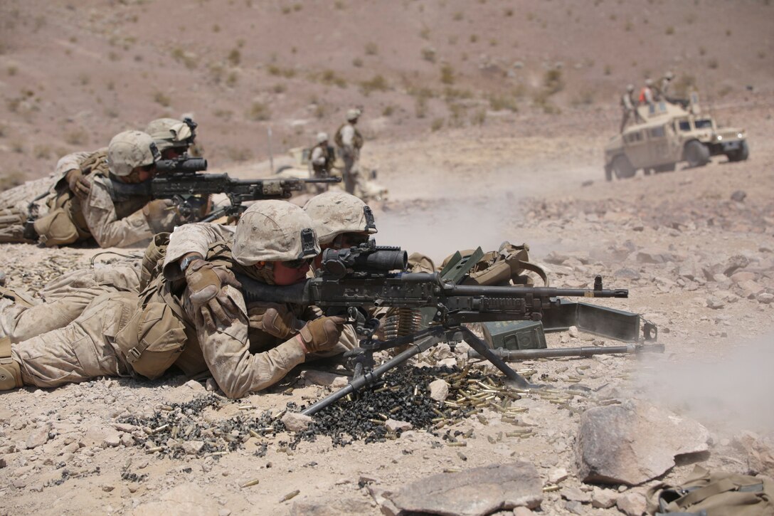 Marines with Bravo Company, 1st Battalion, 23rd Marine Regiment, 4th Marine Division, Marine Forces Reserve, shoot down range during the live fire company attacks during the 2015 integrated training exercise at Marine Corps Air Ground Combat Center Twentynine Palms, California, June 13, 2015. The exercise consisted of a series of combined shooting, fire maneuver and movement in which Marines simulated an encounter and fire suppression against hostile enemies.