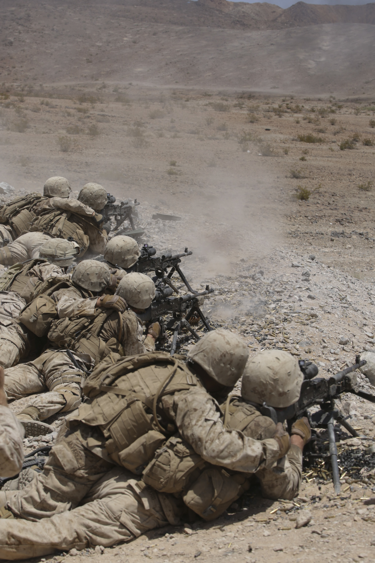 Marines with Bravo Company, 1st Battalion, 23rd Marine Regiment, 4th Marine Division, Marine Forces Reserve, shoot down range during the live fire company attacks during the 2015 integrated training exercise at Marine Corps Air Ground Combat Center Twentynine Palms, California, June 13, 2015. The exercise consisted of a series of combined shooting, fire maneuver and movement in which Marines simulated an encounter and fire suppression against hostile enemies.