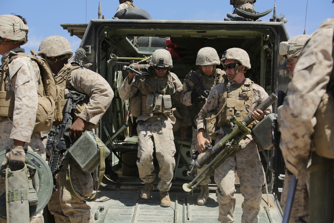 Marines with Alpha Company, 1st Battalion, 23rd Marine Regiment, 4th Marine Division, Marine Forces Reserve exit an Amphibious Assault Vehicle during a motorized operations course exercise during the 2015 Integrated Training Exercise at Marine Corps Air Ground Combat Center Twentynine Palms, Calif., June 15, 2015. During these exercises, infantry Marines are trained to effectively move in and out of AAVs during combat simulations. ITX allows Reserve Marines to train in realistic environments and conditions, which reinforces maintenance of the highest levels of proficiency and readiness in preparation for worldwide deployment and the ability to work as a Marine Air Ground Task Force.