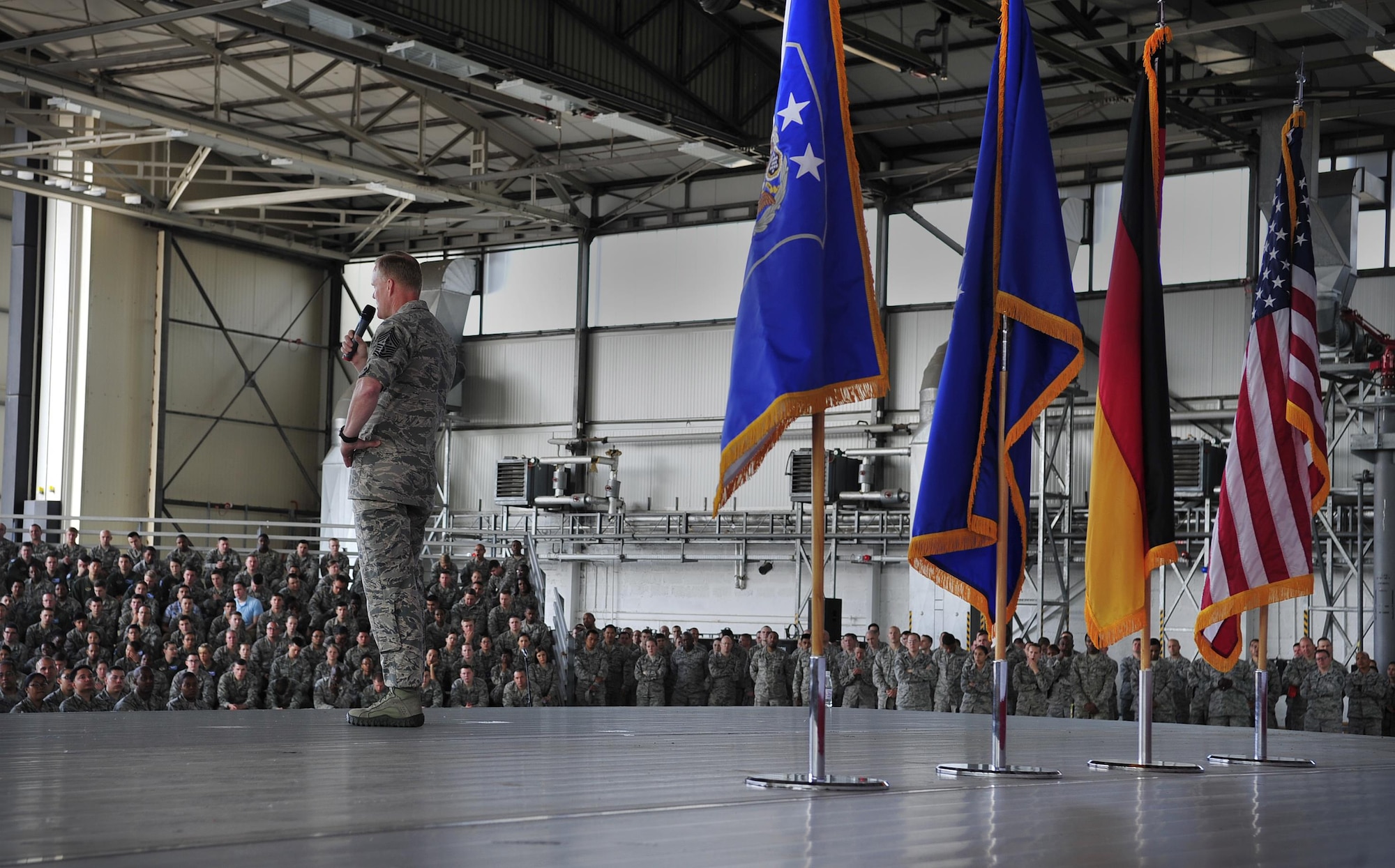 Chief Master Sgt. of the Air Force James A. Cody talks to Airmen during an all call June 15, 2015, at Ramstein Air Base, Germany. Cody answered Airmen’s questions regarding Air Force standards, new processes and entitlements. (U.S. Air Force photo/Airman 1st Class Larissa Greatwood)