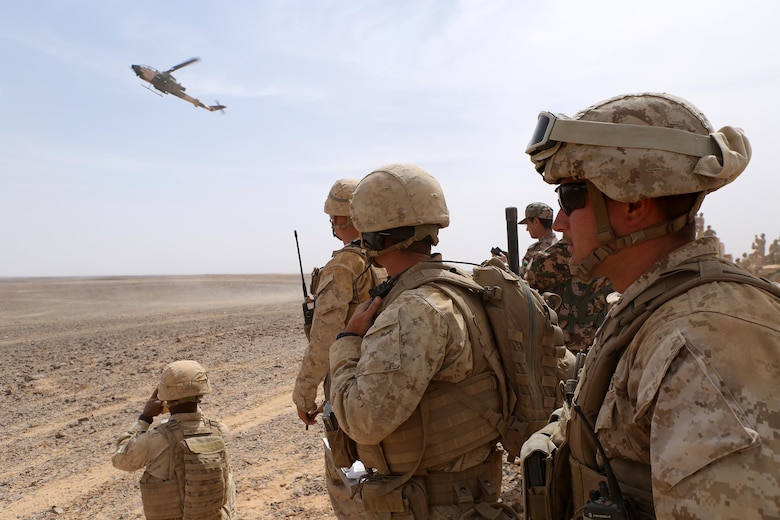 Marines with the Fire Support Team for Kilo Company, Battalion Landing Team 3rd Battalion, 6th Marine Regiment, 24th Marine Expeditionary Unit (MEU), watch a Jordanian armed forces’ AH-1 Cobra engage a simulated target during combined arms live-fire event during exercise Eager Lion 2015 in Jordan, May 18, 2015. Eager Lion is a recurring multi-national exercise designed to strengthen military-to-military relationships, increase interoperability between partner nations and enhance regional security and stability. The 24th MEU is embarked on the ships of the Iwo Jima Amphibious Ready Group and is deployed to maintain regional security in the U.S. 5th Fleet area of operations. (U.S. Marine Corps photo by Sgt. Devin Nichols/Released)