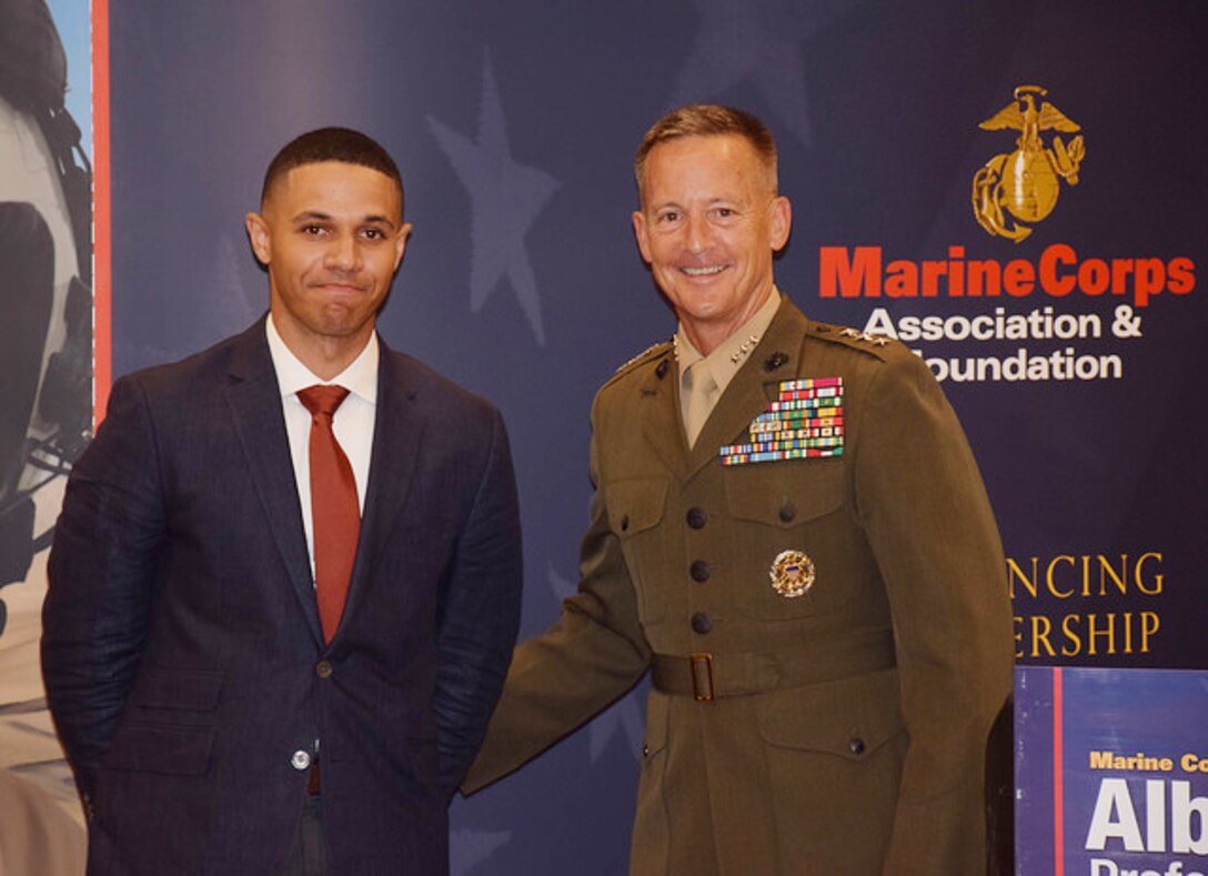 Sgt. Josue Balbuena, enlisted barracks manager and unit energy manager, Marine Corps Logistics Base Albany, poses with Lt. Gen. William Faulkner, deputy commandant, Installations and Logistics, at a Marine Corps Association and Foundation hosted dinner at the Hilton Garden Inn, Albany, Georgia, recently. 