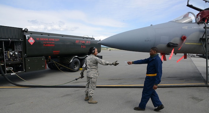 Airman 1st Class Deniqwia Brooks, a 673rd Logistics Readiness Squadron fuels specialist, prepares to fuel an F-15C Eagle on the flightline at Joint Base Elmendorf-Richardson, Alaska, June 8, 2015. The fuels management flight was recently recognized as the best in the Air Force due to its stellar performance despite the fact that they operate out of three geographically distant areas on an installation larger than all other Pacific Air Forces bases combine. (U.S. Air Force photo/Staff Sgt. Wes Wright)