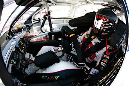 Dale Earnhardt Jr., driver of the No. 88 National Guard NASCAR racecar, is pictured sitting in the driver’s seat during a pit stop at Bristol Motor Speedway in Bristol, Tenn., March 20, 2011. Dale Jr. finished the day with an 11th place finish, moving him into ninth place in the points race.