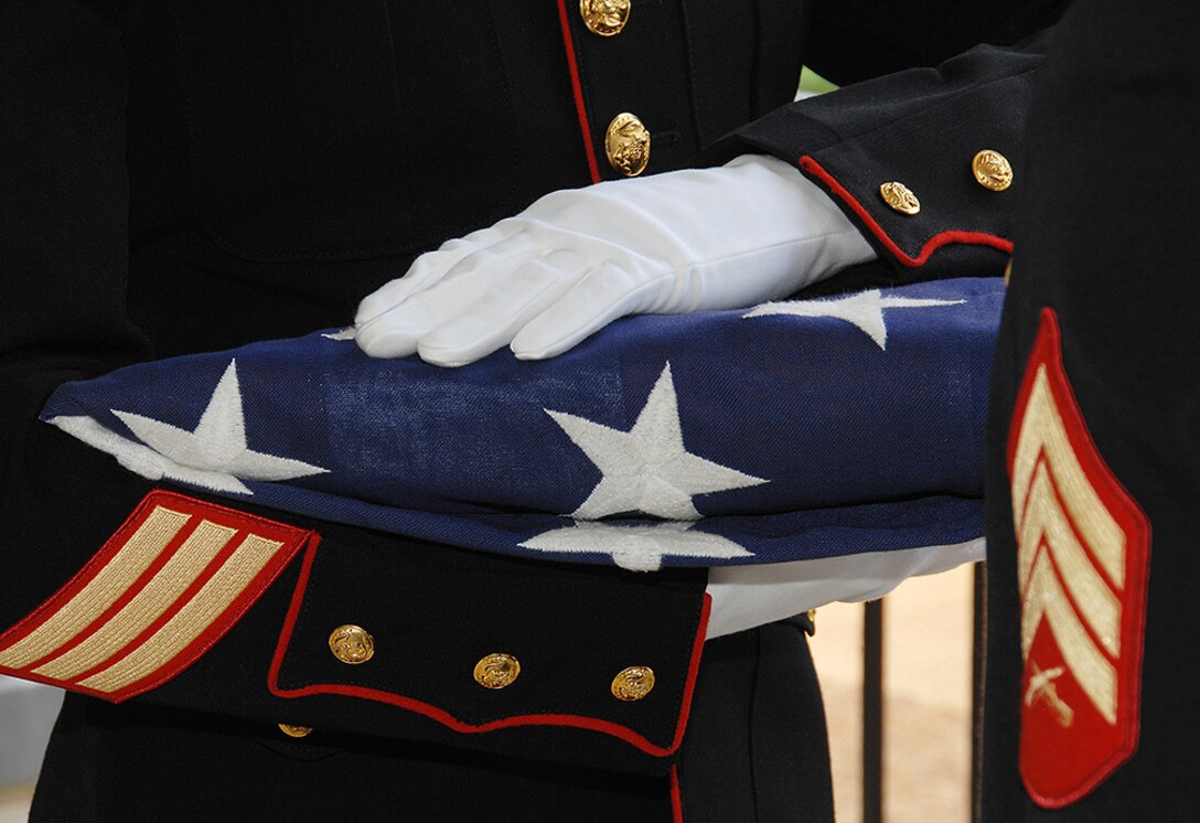 Marines with Marine Corps Logistics Base Albany’s Military Funeral Honors Detail conduct a military funeral for a fallen service member at Andersonville National Cemetery, Andersonville, Ga., June 10. The detail consisted of an eight-man team conducting the 21-gun salute, a bugler and a two-man flag team. A Marine from the two-man flag team presented the family with the folded national ensign upon completion of the ceremony. Marines attached to MCLB Albany conduct about 75 military funerals honors each year throughout the Southeast region. 
