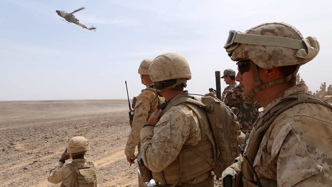 Marines with the Fire Support Team for Kilo Company, Battalion Landing Team 3rd Battalion, 6th Marine Regiment, 24th Marine Expeditionary Unit (MEU), watch a Jordanian armed forces’ AH-1 Cobra engage a simulated target during combined arms live-fire event during exercise Eager Lion 2015 in Jordan, May 18, 2015. Eager Lion is a recurring multi-national exercise designed to strengthen military-to-military relationships, increase interoperability between partner nations and enhance regional security and stability. The 24th MEU is embarked on the ships of the Iwo Jima Amphibious Ready Group and is deployed to maintain regional security in the U.S. 5th Fleet area of operations. 