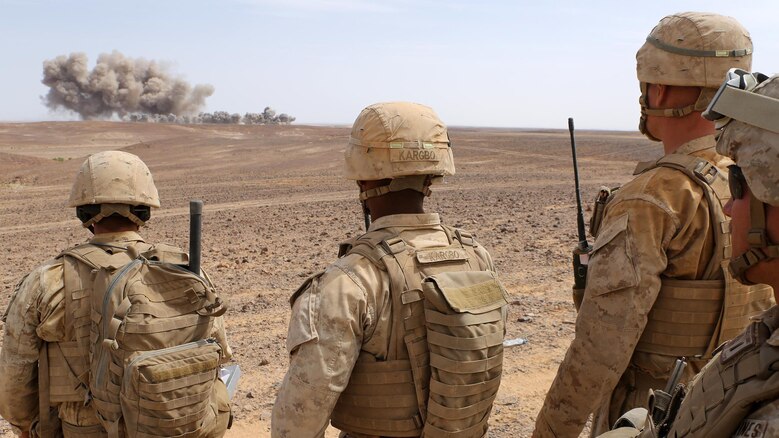 Marines with the Fire Support Team for Kilo Company, Battalion Landing Team 3rd Battalion, 6th Marine Regiment, 24th Marine Expeditionary Unit (MEU), observe ordnance from U.S. Air Force B-52 Stratofortress bombers during a combined arms live-fire event as part of exercise Eager Lion 2015 in Jordan, May 18, 2015. Eager Lion is a recurring multi-national exercise designed to strengthen military-to-military relationships, increase interoperability between partner nations and enhance regional security and stability. The 24th MEU is embarked on the ships of the Iwo Jima Amphibious Ready Group and is deployed to maintain regional security in the U.S. 5th Fleet area of operations. 