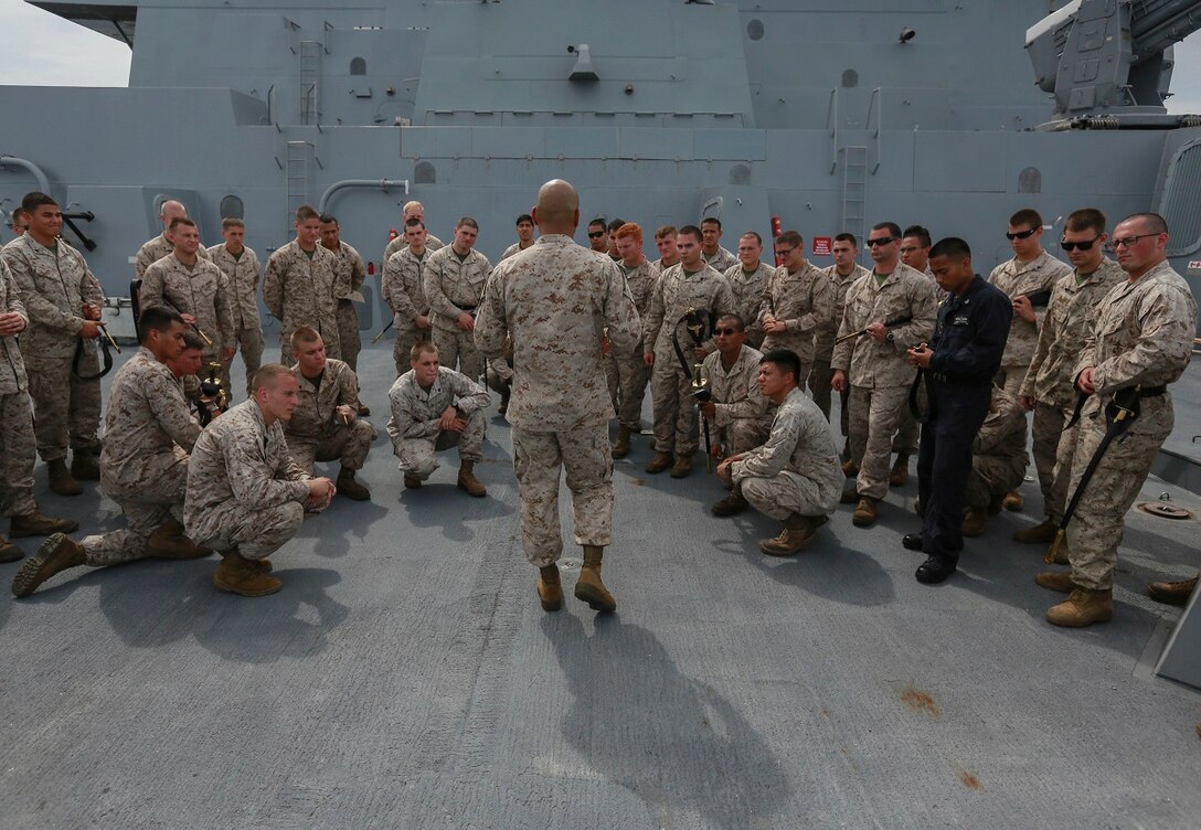 U.S. Marine Staff Sgt. Jose Mireles mentors his students during a Corporals Course aboard the USS Anchorage (LPD 23) in the South China Sea, June 13, 2015. Mireles is a supply chief with Battalion Landing Team 3rd Battalion, 1st Marine Regiment, 15th Marine Expeditionary Unit, and a faculty advisor for the Corporals Course aboard the USS Anchorage. Marines participate in corporals courses, even while deployed, to ensure they have the tools to be better leaders. (U.S. Marine Corps photo by Sgt. Steve H. Lopez/ Released)