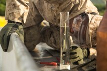 Pfc. Deantre P. Thornton checks the temperature of newly received fuel June 3 at Doksukri Training Area, Republic of Korea, during Korean Military Exchange Program 15-9. The Marines use a hydrometer to test the temperature and the American Petroleum Industry levels of the fuel to confirm its quality. The Marines received 15,000 gallons of fuel, which will be used for vehicles and equipment throughout the duration of the exercise. Bulk fuel Marines stationed on Okinawa train with simulated fuel while training on the Korean peninsula allows for them to use actual fuel. This KMEP has been designated as the engineering KMEP with a concentration in bulk fuel and continuation of training focused on maintaining operational presence while improving key relationships across the region. Thornton, from Atlanta, Georgia, is a bulk fuel specialist with 9th Engineer Support Battalion, 3rd Marine Logistics Group, III Marine Expeditionary Force. (U.S. Marine Corps photo by Cpl. Joey S. Holeman, Jr./ Released)