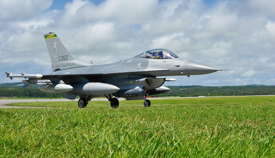 A U.S. Air Force F-16 Fighting Falcon from the Vermont Air National Guard’s 158th Fighter Wing, taxis to a hanger for a security check on the flightline of Kadena Air Base, Japan, June 16, 2015. Approximately 150 personnel and 10 F-16s from the 158th FW at South Burlington, Vt., are set to deploy to the 18th Wing at Kadena Air Base in Okinawa, Japan. The Theater Security Package deployment is designed to provide the Pacific Command region with forces capable of a variety of operations, including disaster relief, global situational awareness, combating piracy, active defense and power projection. (U.S. Air Force photo by Naoto Anazawa)

