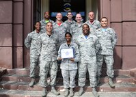 Members of the Hickam First Sergeants' Council pose for a photo with the first Diamond Sharp Award recipient Staff Sgt. Amani Phillips, 647th CES NCOIC commanders’ support staff, on Joint Base Pearl Harbor-Hickam, Hawaii, June 12, 2015. The Diamond Sharp Award is a monthly award presented by the Hickam First Sergeants' Council as an additional way to spotlight exceptional Airmen who are going above and beyond. (U.S. Air Force photo by Tech. Sgt. Aaron Oelrich/Released)