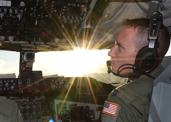 Capt. Matt Savage, 96th Air Refueling Squadron pilot, conducts preflight checks from the cockpit of a KC-135 Stratotanker prior to the final operational mission of the 96th ARS on Joint Base Pearl Harbor-Hickam, Hawaii, June 11, 2015. Savage flew the number four aircraft in a four ship of KC-135s during the mission. Throughout the flight the aircrew executed refueling operations for two F-22 Raptors, from the 199th Fighter Squadron. The aircrew continued to show the range of KC-135 capabilities by completing defensive maneuvering as a four ship. (U.S. Air Force Photo by Tech Sgt. Aaron Oelrich/Released)