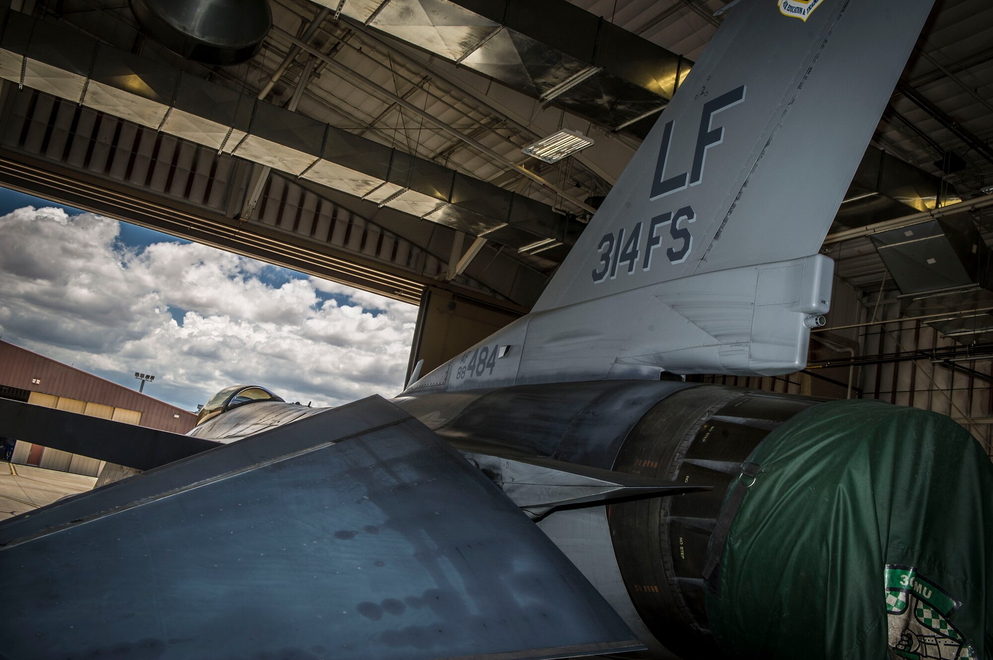 An F-16 Fighting Falcon from Luke Air Force Base, Ariz., parks in a hangar after arriving at Holloman Air Force Base, N.M., June 16, 2015. The 308th Fighter Squadron and their F-16s have moved their base of operations to Holloman as a tenant unit, along with other squadrons from the 54th Fighter Group. (U.S. Air Force photo by Airman 1st Class Emily Kenney / Released)


