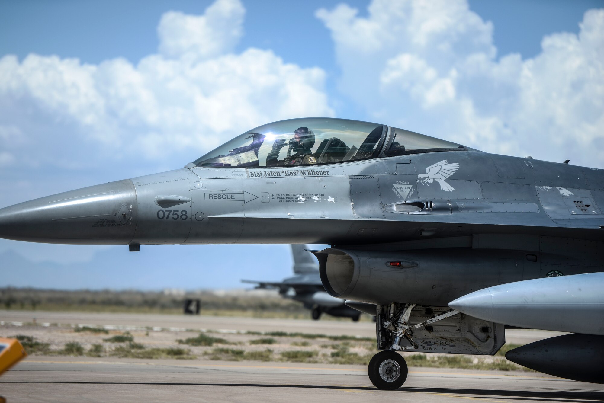 An F-16 Fighting Falcon from the 314th Fighter Squadron taxis toward its new home in the hangars of Holloman Air Force base, N.M., June 16, 2015. Luke Air Force Base, Ariz. has transferred the 54th Fighter Group, which consists of two squadrons in order to conduct their F-16 training in Holloman’s airspace. (U.S. Air Force photo by Senior Airman Chase Cannon / Released)