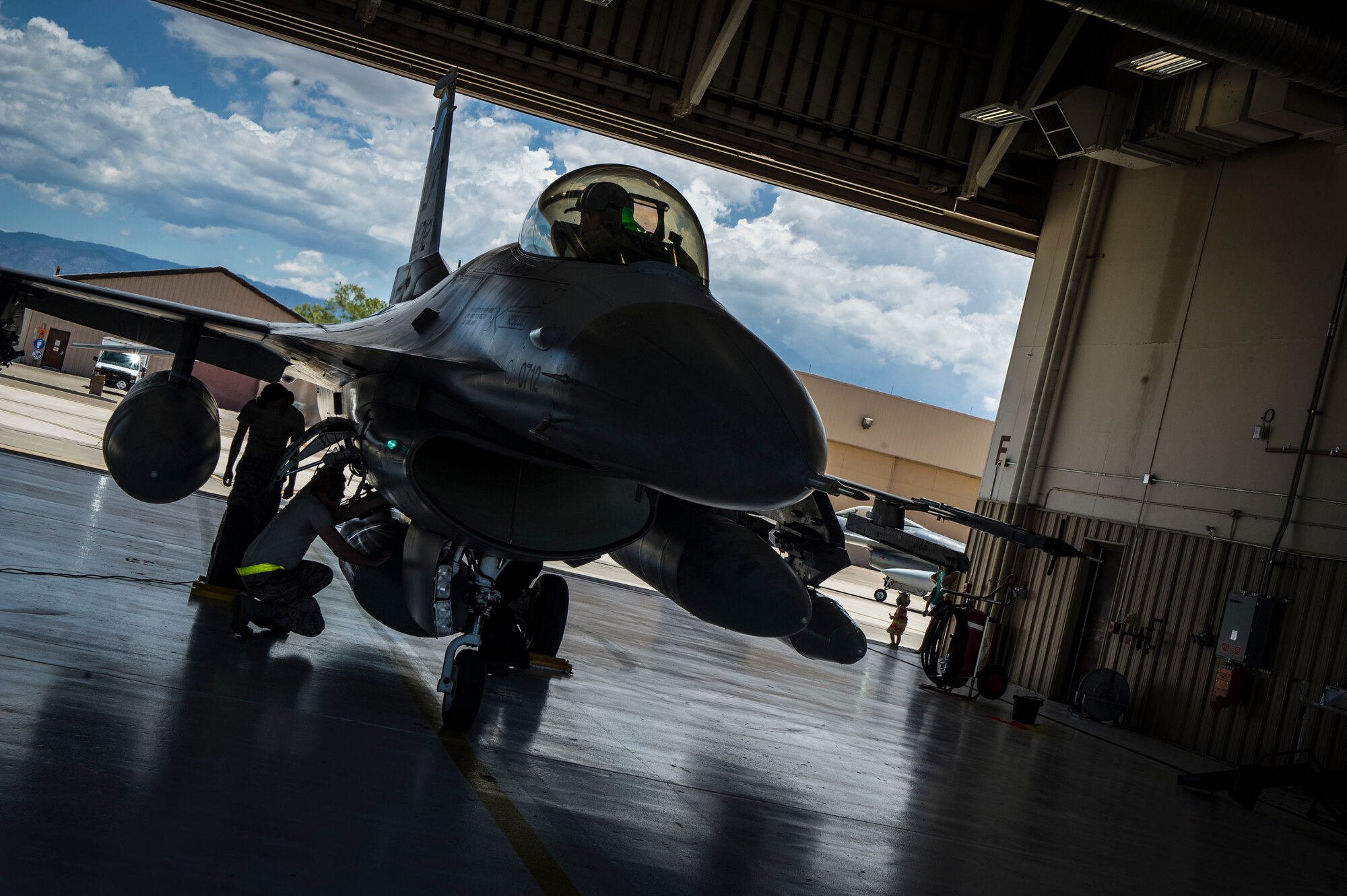 An F-16 Fighting Falcon from Luke Air Force Base, Ariz., parks in a hangar after arriving at Holloman Air Force Base, N.M., June 16, 2015. The 54th Fighter Group will be activating the 314th Fighter Squadron with the 12 F-16s that have been transferred to Holloman. In March of 2014, the 54th Fighter Group was activated at Holloman, the 314th FS is the second squadron to transfer from Luke. (U.S. Air Force photo by Airman 1st Class Emily Kenney / Released)


