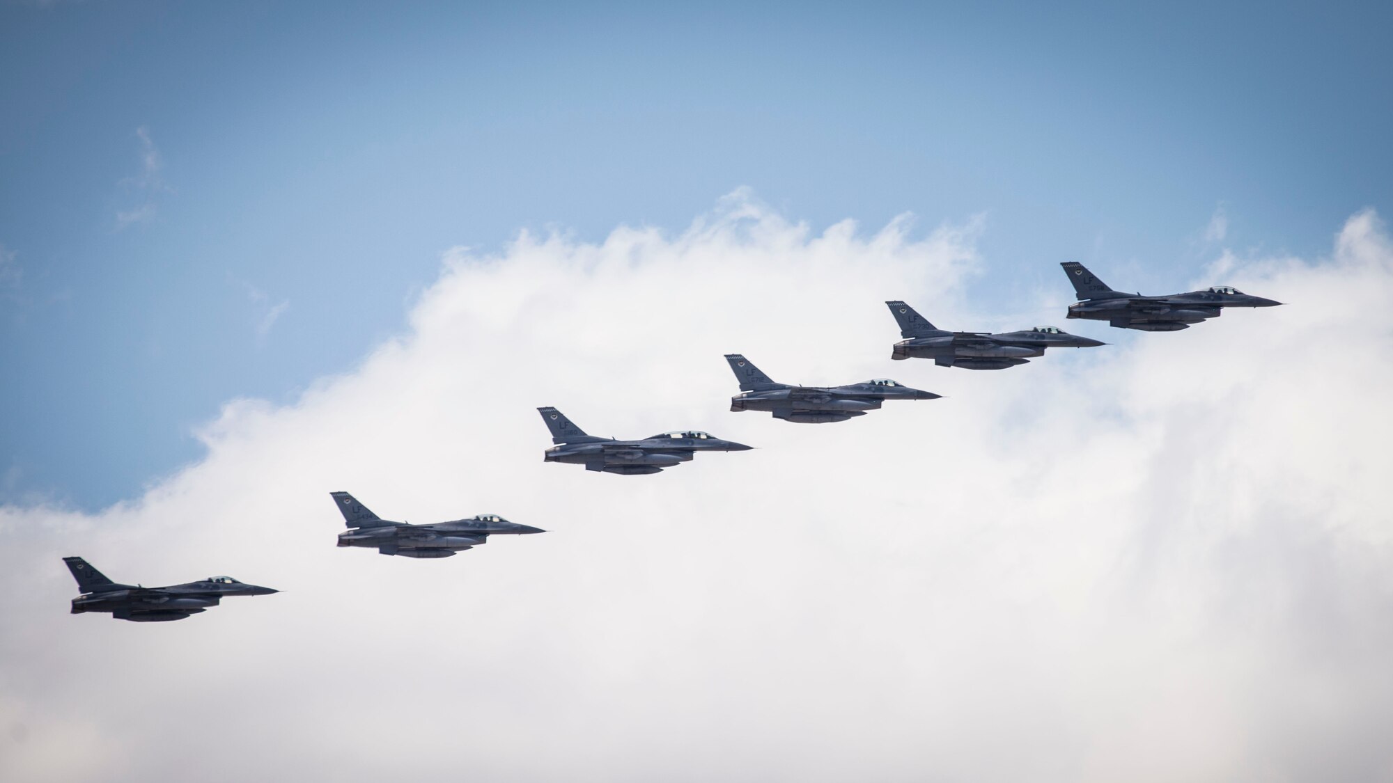 Six F-16 Fighting Falcons from Luke Air Force Base, Ariz. arrive in formation at Holloman Air Force Base, N.M., June 16, 2015. The 314th Fighter Squadron and their F-16s have moved their base of operations to Holloman as a tenant unit, along with other squadrons from the 54th Fighter Group. The 314th FS will be soon be activated so they can continue their training mission at Holloman. (U.S. Air Force photo by Senior Airman Aaron Montoya / Released)