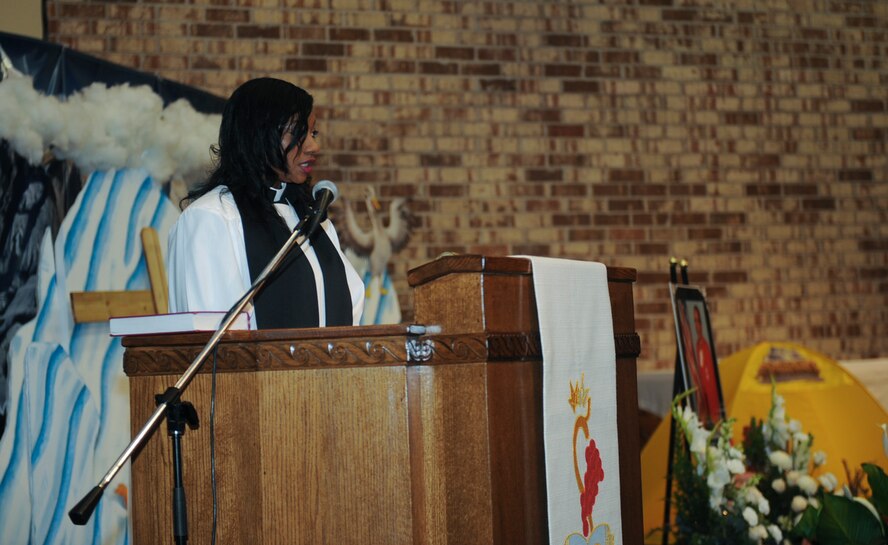 Deacon Yvette Owens, mistress of ceremony, speaks during a memorial service held for Velma Head June 11, 2015, at Moody Air Force Base, Ga. Head served a total of 48 group and squadron commanders during her time at Moody. (U.S. Air For photo by Senior Airman Olivia Bumpers)