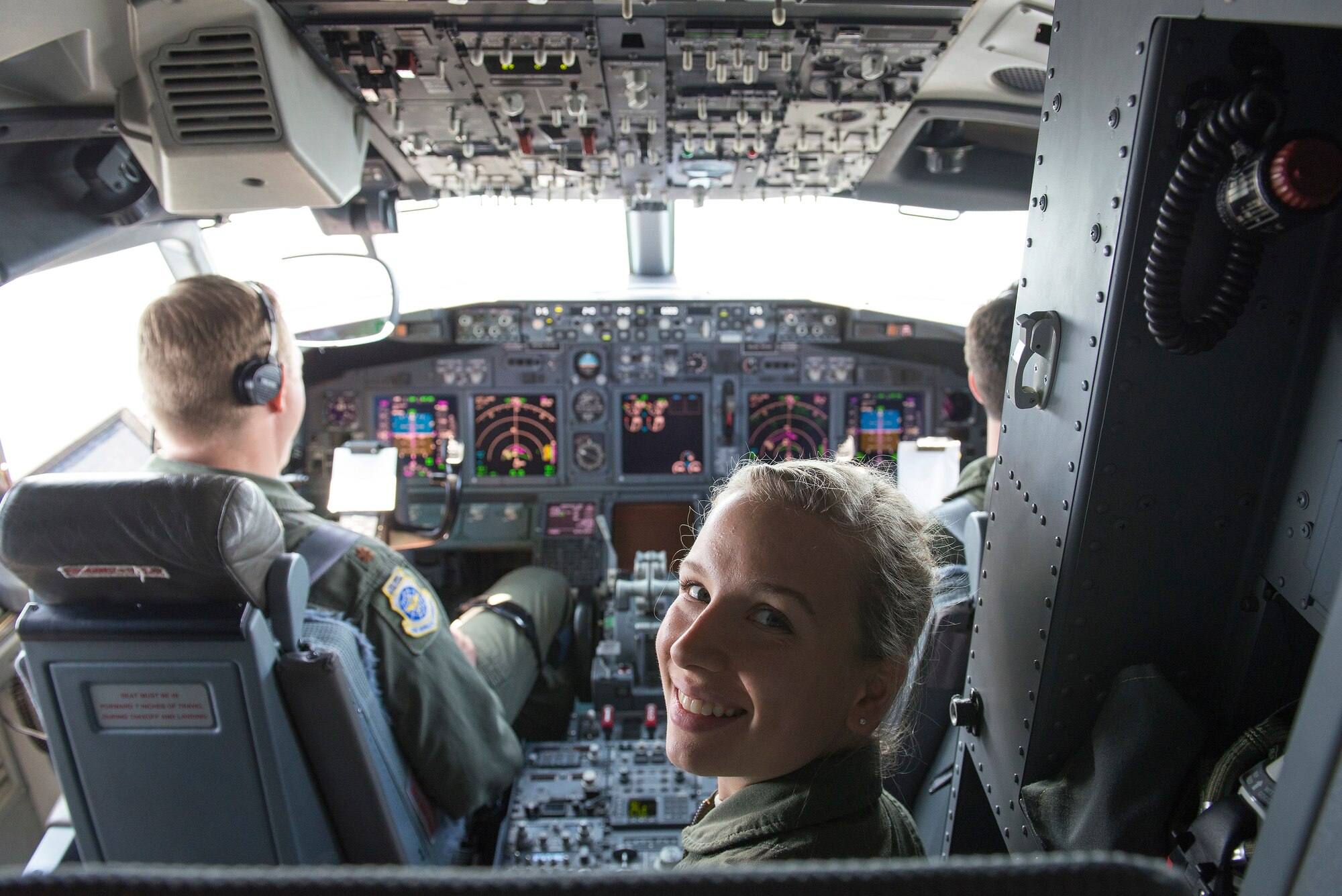 Cadet 2nd Class Kirsten Mattson sits in the cockpit of a C-40 June 8, 2015, at Scott Air Force Base, Illinois. Mattson was one of 10 Air Force Academy cadets who visited Scott to learn more about the variety of career fields in the Air Force. Mattson is a rising junior at the Air Force Academy. (U.S. Air Force Photo by Airman 1st Class Megan Friedl)