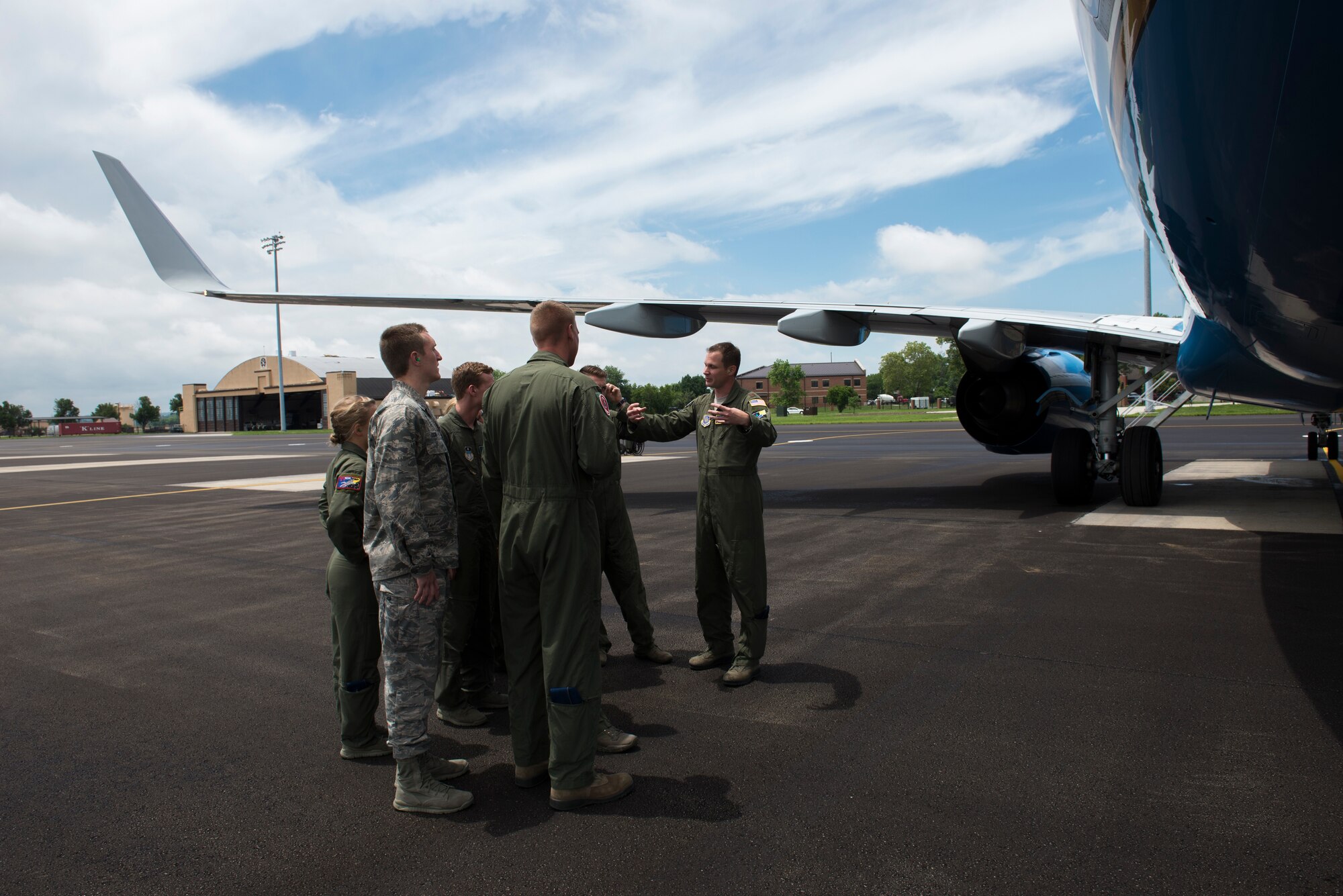 Maj. Jonathan Lauer talks to cadets outside a C-40 June 8, 2015, at Scott Air Force Base, Illinois. Lauer informed the Air Force Academy cadets about the aircraft and answered any of their questions. Lauer is a 54th Airlift Squadron C-40 Pilot. (U.S. Air Force Photo by Airman 1st Class Megan Friedl)