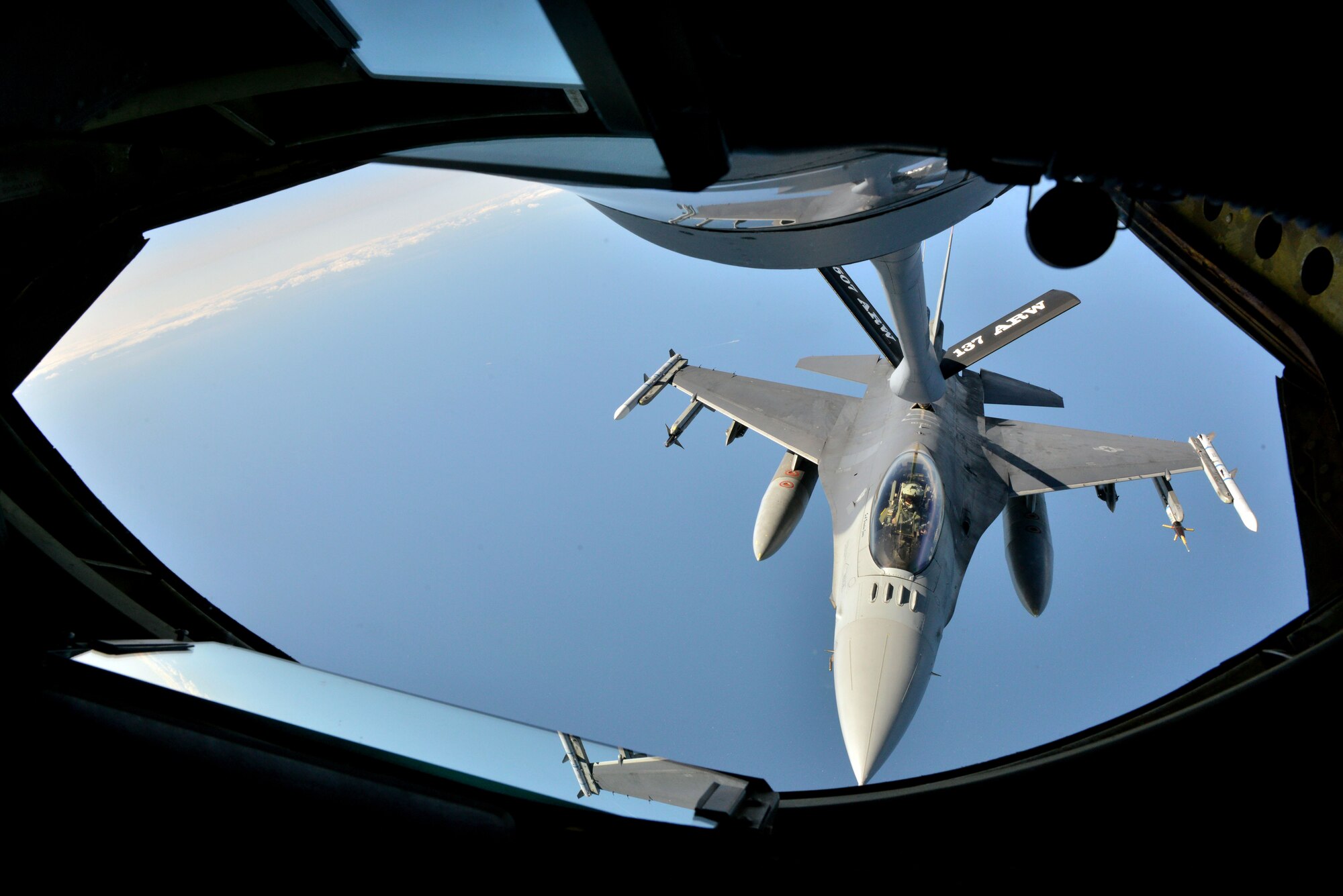 An F-16 Fighting Falcon from the 480th Fighter Squadron receives fuel from a KC-135 Stratotanker after during Baltic Operations 2015 refueling mission June 15, 2015, at Powidz Air Base, Poland. Along with BALTOPS 2015, the U.S. Air Force is also participating in U.S Army Europe-led cooperative training exercise Saber Strike 2015 and Polish-led combined exercise EAGLE TALON in the Baltic Region, all of which are supported by the Aviation Detachment located at Lask and Powidz air bases in Poland. (U.S. Air Force photo by Senior Airman Michael Battles) 