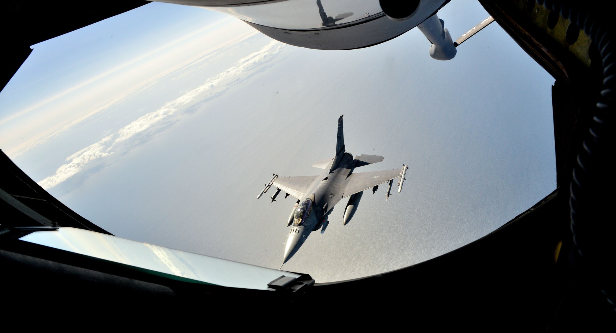 An F-16 Fighting Falcon from the 480th Fighter Squadron maneuvers away from a KC-135 Stratotanker after being refueled during Baltic Operations 2015 refueling mission June 15, 2015, at Powidz Air Base, Poland. The U.S., NATO and partner nations sent 49 ships, 61 aircraft, one submarine, and approximately 5,600 Sailors, Marines, Airmen and Soldiers to employ land, air, sea and undersea capabilities to support the 15-day exercise. (U.S. Air Force photo by Senior Airman Michael Battles) 