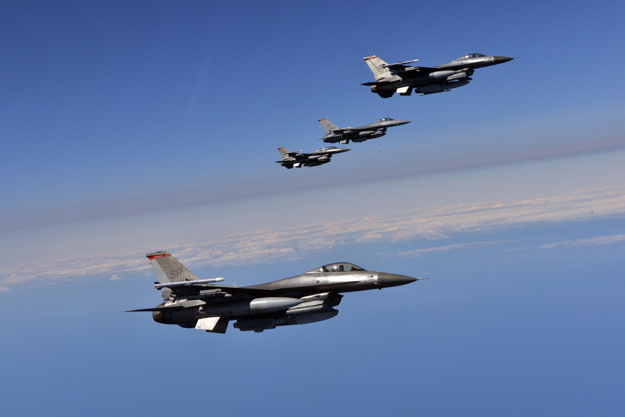 Four F-16 Fighting Falcons from the 480th Fighter Squadron fly in formation over the Baltic Sea as part of a Baltic Operations 2015 refueling mission June 15, 2015, at Powidz Air Base, Poland. BALTOPS is a multinational maritime exercise in Poland, Sweden, Germany, and throughout the Baltic Sea, including participation from 14 NATO and three partner nations June 5-20. (U.S. Air Force photo by Senior Airman Michael Battles) 