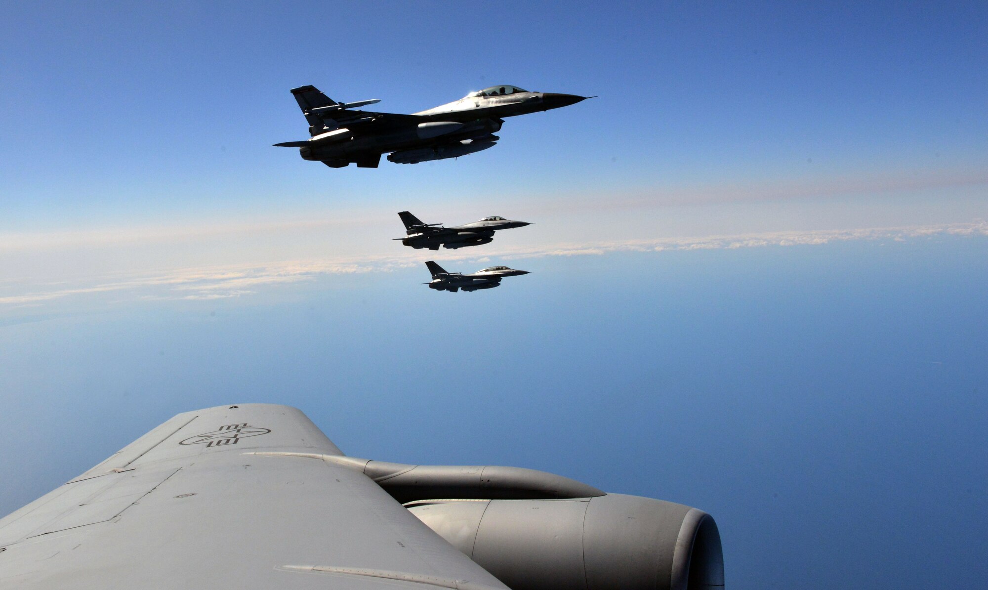 Three F-16 Fighting Falcons from the 480th Fighter Squadron fly in formation alongside a KC-135 Stratotanker during a Baltic Operations 2015 refueling mission June 15, 2015, at Powidz Air Base, Poland. BALTOPS is a multinational maritime exercise in Poland, Sweden, Germany, and throughout the Baltic Sea, including participation from 14 NATO and three partner nations June 5-20. (U.S. Air Force photo by Senior Airman Michael Battles) 