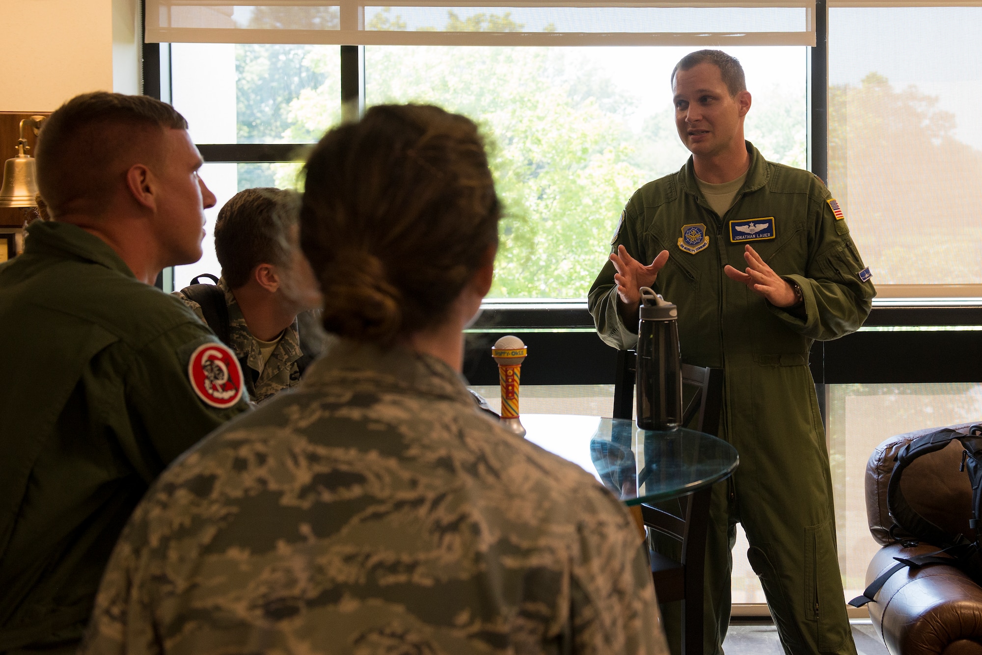 Maj. Jonathan Lauer talks to cadets after flying on a C-40 June 8, 2015, at Scott Air Force Base, Illinois. Lauer informed Air Force Academy cadets about the normal procedures done after a flight. Lauer is a 54th Airlift Squadron C-40 Pilot. (U.S. Air Force Photo by Airman 1st Class Megan Friedl)