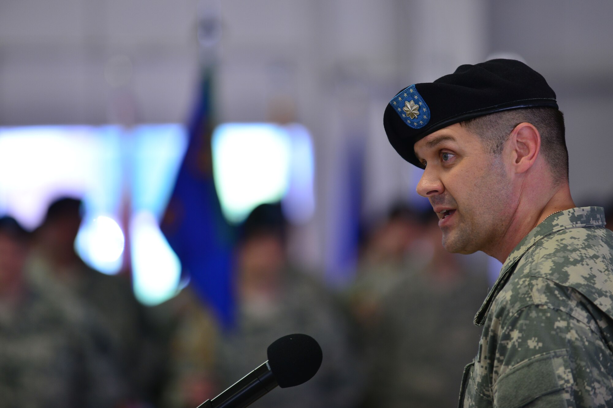 U.S. Army Lt. Col. Russ Heidel Jr., 1st Battalion, 210th Aviation Regiment incoming commander, speaks at his change of command ceremony at Fort Eustis, Va., June 12, 2015. Heidel spoke to his new unit about his leadership style and emphasized the important role family plays in mission success. (U.S. Air Force photo by Staff Sgt. Natasha Stannard/Released)