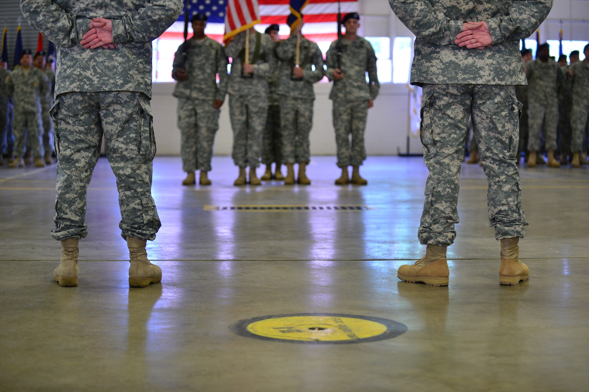 U.S. Army Lt. Col. Russ Heidel Jr., 1st Battalion, 210th Aviation Regiment incoming commander, and Lt. Col. Richard W. Alexander II, 1st Battalion, 210th Aviation Regiment outgoing commander  stand at parade rest during their change of command at Fort Eustis, Va., June 12, 2015. Both commanders were recognized for their leadership qualities by Col. Julius A. Rigole, 128th Aviation Brigade commander and officiating officer. (U.S. Air Force photo by Staff Sgt. Natasha Stannard/Released)
