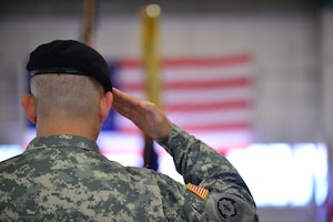 U.S. Army Col. Julius A. Rigole, 128th Aviation Brigade commander, salutes the U.S. flag during a change of command ceremony at Fort Eustis, Va., June 12, 2015. Rigole presided over the ceremony during which Lt. Col. Russ Heidel Jr., 1st Battalion, 210th Aviation Regiment incoming commander, took command of the 1st Battalion, 210th Aviation Regiment. (U.S. Air Force photo by Staff Sgt. Natasha Stannard/Released) 