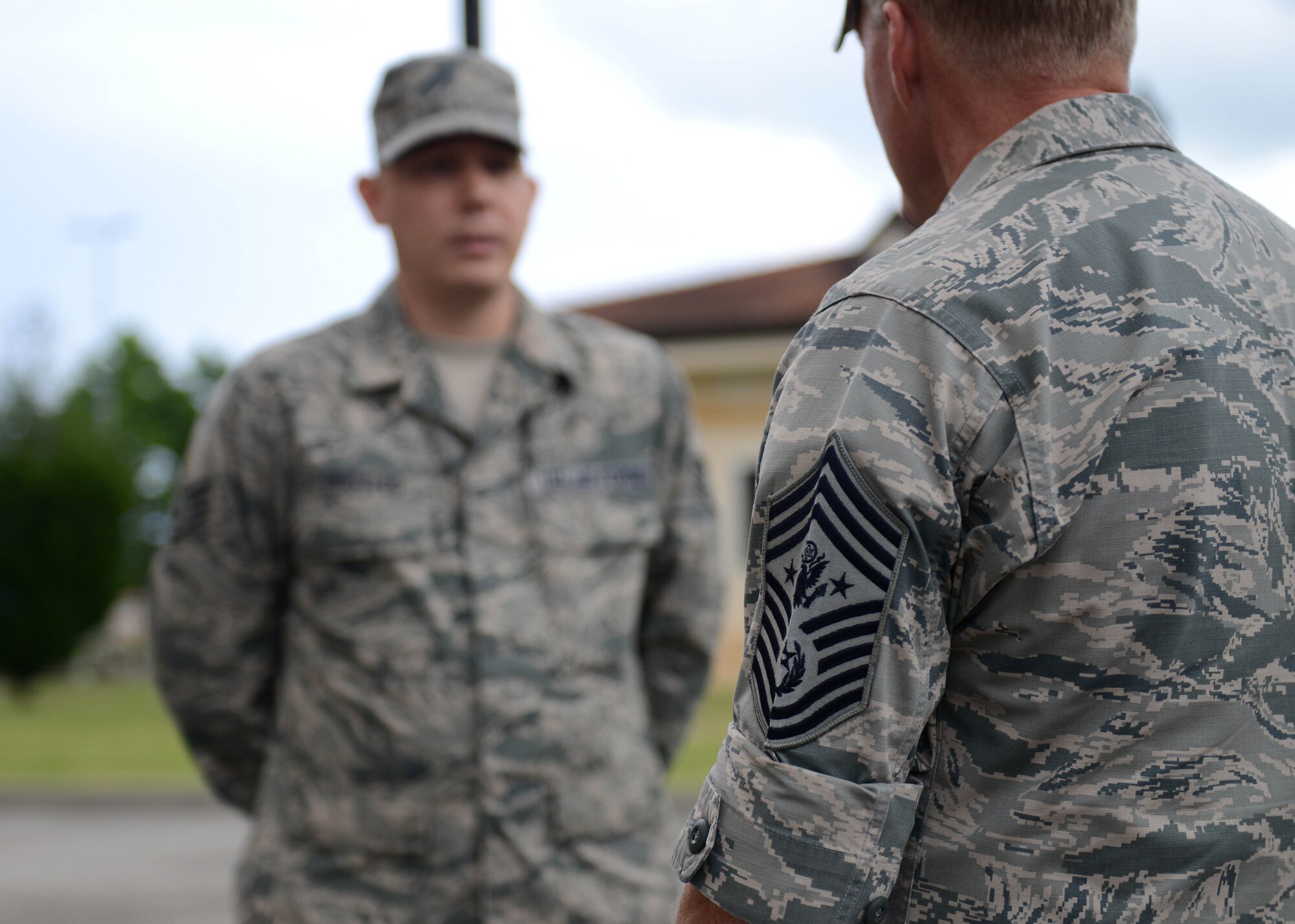 Staff Sgt. Aaron Broyles, 31st Operations Support Squadron airfield systems supervisor, is recognized as a “Worthy Wyvern” by Chief Master Sergeant of the Air Force James A. Cody during a base visit, June 16, 2015, at Aviano Air Base, Italy. Cody visited Aviano to thank Airmen and their families for their continued sacrifices, receive feedback on important topics and learn more about Aviano’s mission. (U.S. Air Force photo by Airman 1st Class Deana Heitzman/Released)  
