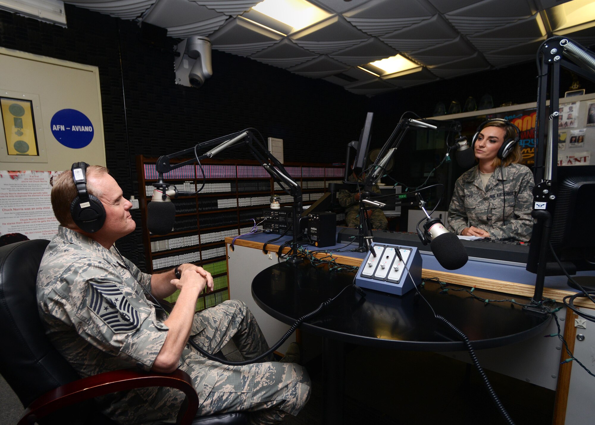 Senior Airman Lindsey Gulliver, Detachment 8, American Forces Network broadcast journalist, interviews Chief Master Sergeant of the Air Force James A. Cody during a base visit, June 16, 2015, at Aviano Air Base, Italy. Cody visited Aviano to thank Airmen and their families for their continued sacrifices and called on leaders to renew their focus on family resiliency. (U.S. Air Force photo by Airman 1st Class Deana Heitzman/Released)