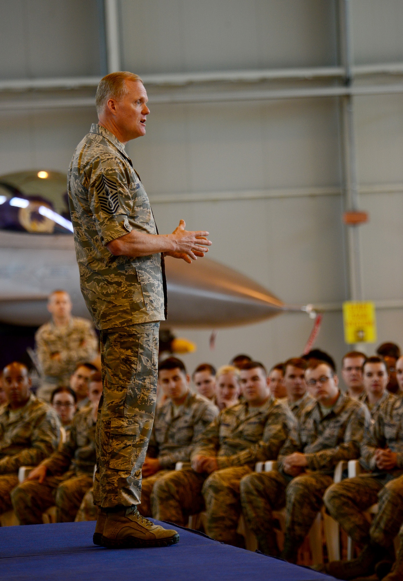 Chief Master Sergeant of the Air Force James A. Cody speaks to Airmen during an all call, June 16, 2015, at Aviano Air Base, Italy. Cody visited Aviano to thank Airmen and their families for their continued sacrifices and called on leaders to renew their focus on family resiliency. (U.S. Air Force photo by Airman 1st Class Deana Heitzman/Released)