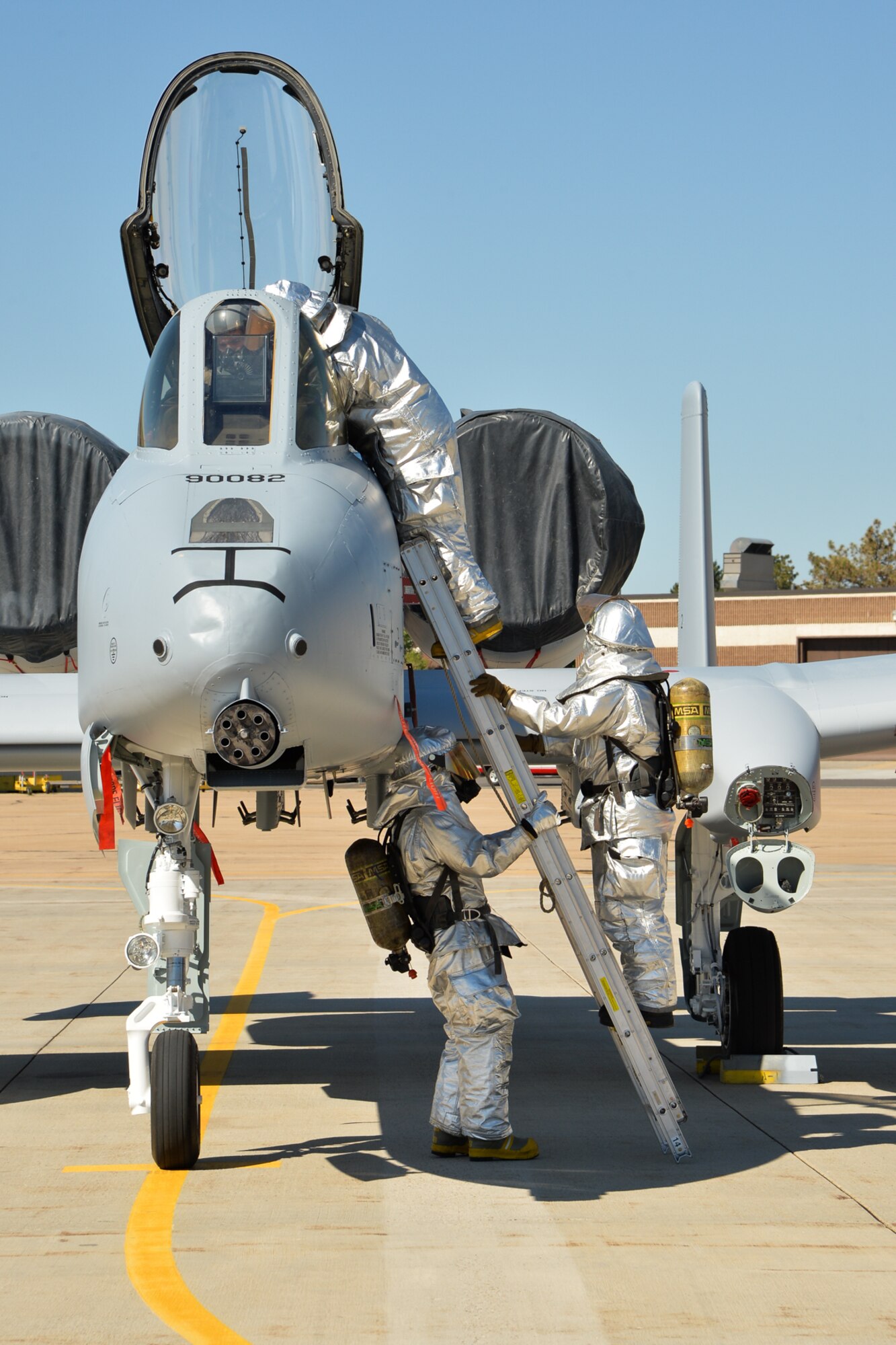 Hill AFB firefighters practice pulling an "unconscious" pilot out of an A-10 cockpit during training recently. Hill Fire and Emergency Services members train constantly to remain proficient in a variety of response roles unique to their Air Force mission. (U.S. Air Force/Ron Bradshaw)