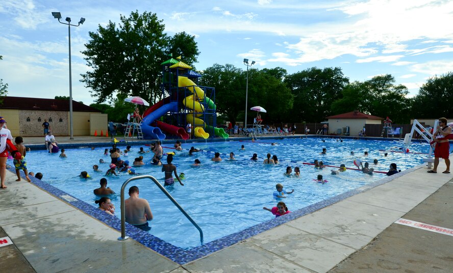 Members of Team Barksdale swim and play in the pool during the annual Pool Bash on Barksdale Air Force Base, La., June 12, 2015. The event was held to celebrate the opening of the pool for the summer season. (U.S. Air Force photo/Airman 1st Class Mozer O. Da Cunha)