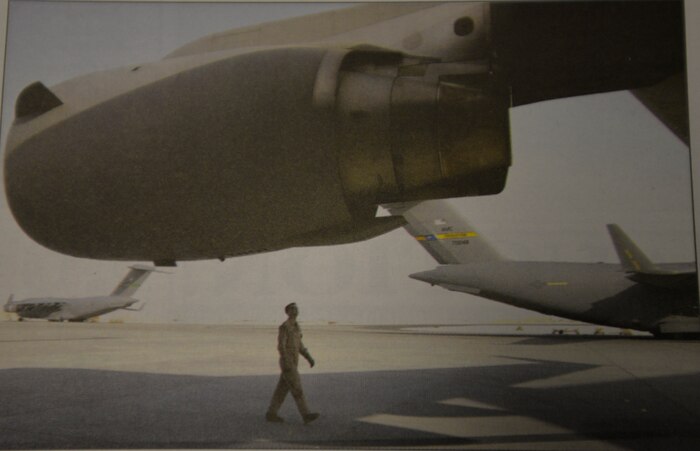 Captain Pat Farrell performs a preflight check of a C-17 July 3 at a forward operating base in Southwest Asia prior to flying an airdrop mission.. Captain Farrell is deployed from Charleston AFB and assigned to the 816th Expeditionary Airlift Squadron, one of two C-17 squadrons in the area of responsibility now deployed in rotation periods similar to air and space expeditionary force deployments. (U.S. Air Force photo / Tech. Sgt. Chuck Marsh)