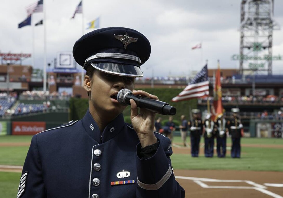 Tech. Sgt. Nalani Quintello sings "America the Beautiful" and the national anthem at Citizens Bank Park in Philadelphia, Pennsylvania, June 6, 2015. On the 71st Anniversary of D-Day, the Philadelphia Phillies recognized military veterans before the game and featured military members throughout the game. (U.S. Air Force photo/Airman 1st Class Philip Bryant)