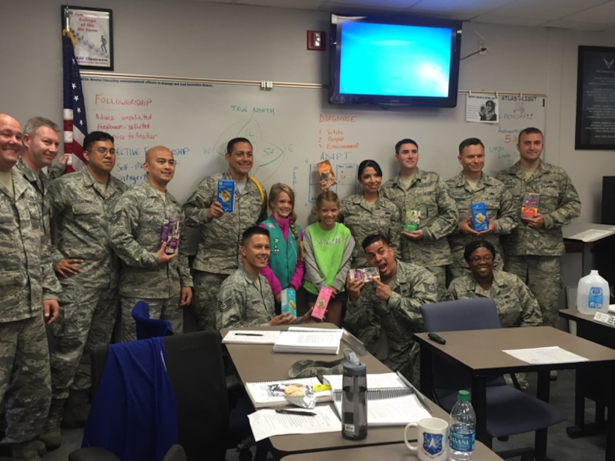 PETERSON AIR FORCE BASE, Colo. – Members of Girl Scouts of America Daisy Troop 43616 give Vosler NCO Academy students Girl Scout cookies during Operation Gratitude, June 5, 2015. Operation Gratitude is a program where members of the community will build and send care packages to Armed Forces members worldwide through donations like the Girls Scouts Troops to Troop program. (Photo courtesy Daisy Troop 43616)