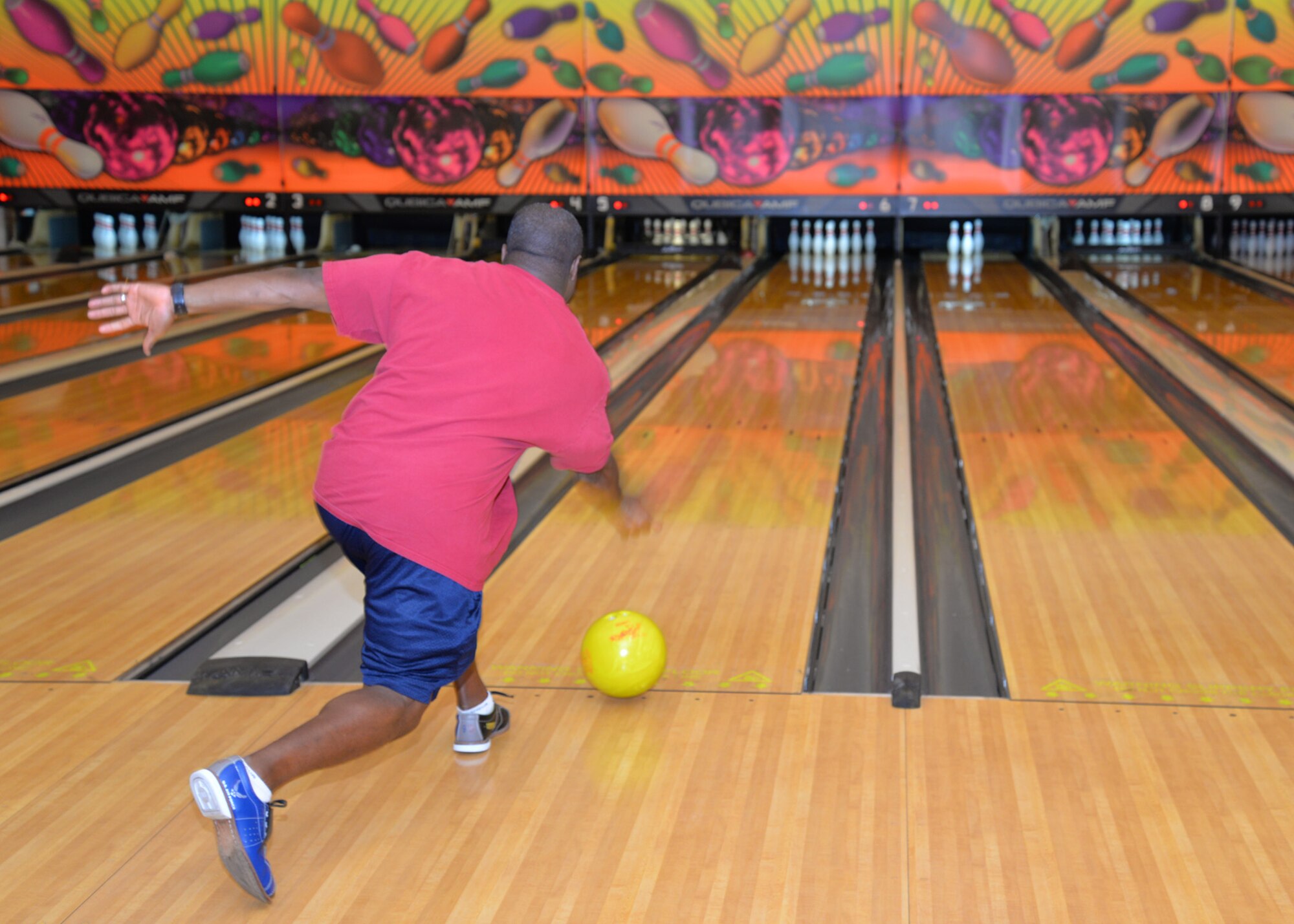 U.S. Air Force Senior Master Sgt. Cornelious Thompson, 100th Operations Group superintendent from Copperas Cove, Texas, bowls a strike during the bowling event during the Marauder Melee June 11, 2015, on RAF Mildenhall, England. Sports competitions included volleyball, soccer and tennis. The 100th Air Refueling Wing Staff Agency team was victorious overall and took this year’s trophy. (U.S. Air Force photo by Karen Abeyasekere/Released)