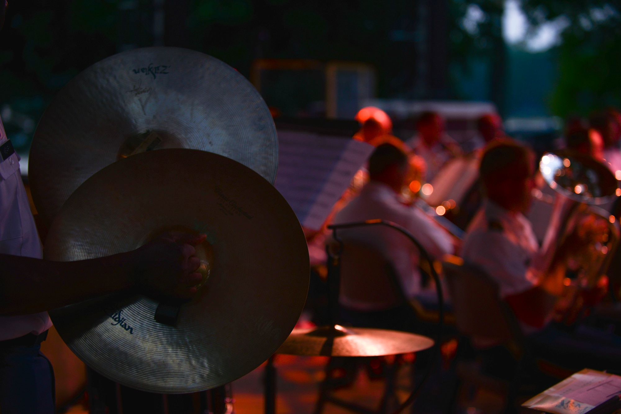 The U.S. Army Training and Doctrine Command Band concert ensemble performs the Army song during the 240th Army Birthday concert and streamer ceremony at Fort Eustis, Va., June 12, 2015. The band played each U.S. service branch’s song, showing patronage for their comrades as they closed the ceremony. (U.S. Air Force photo by Staff Sgt. Natasha Stannard)